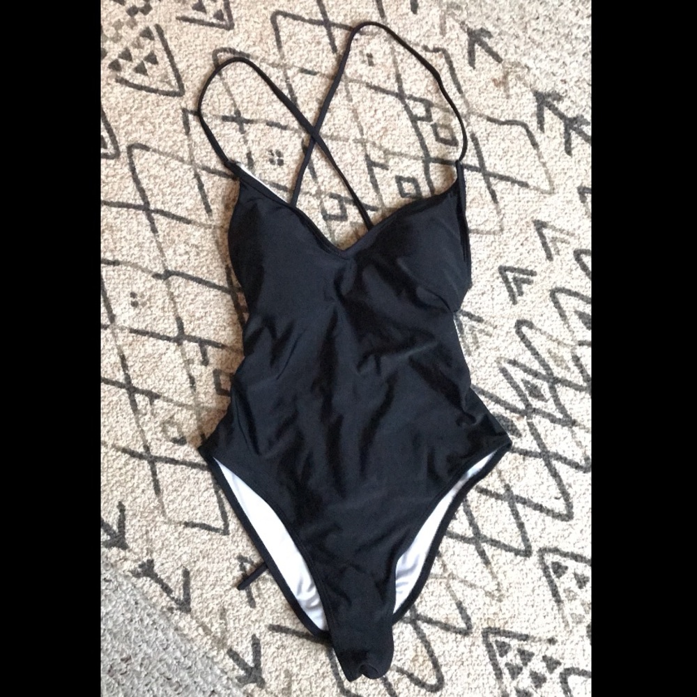 Black back-cross one piece NWOT